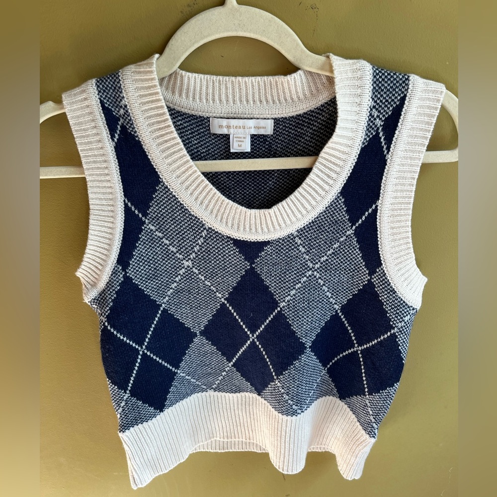 Blue plaid sweater vest with white trim